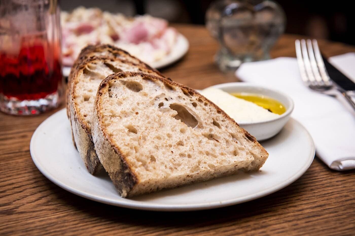 House-baked rye sourdough bread with cultured butter at Lapinou