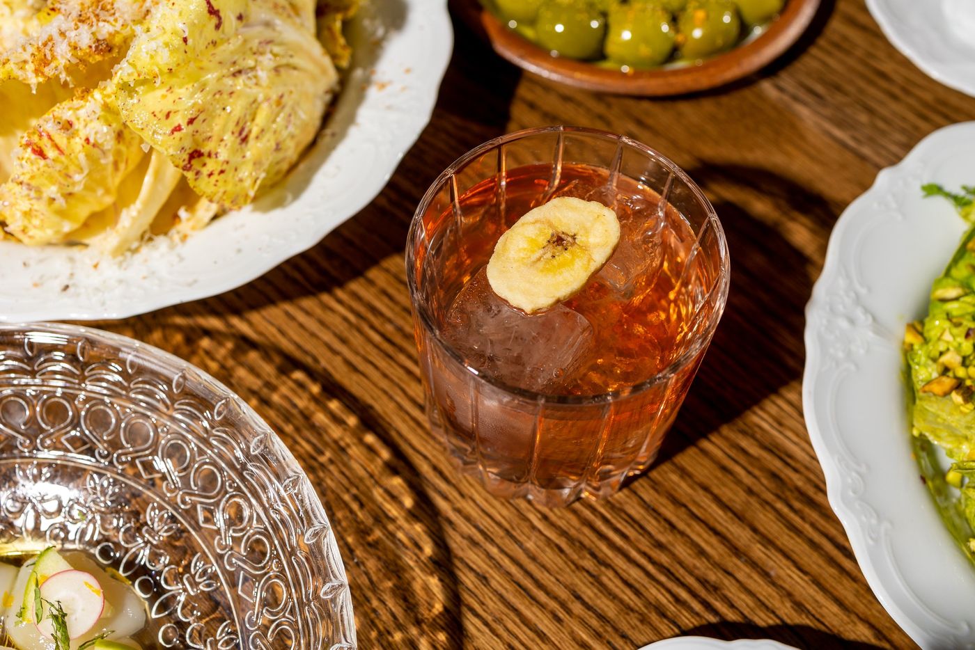 Shared French plates and a cocktail at Lapinou Bistro Toronto